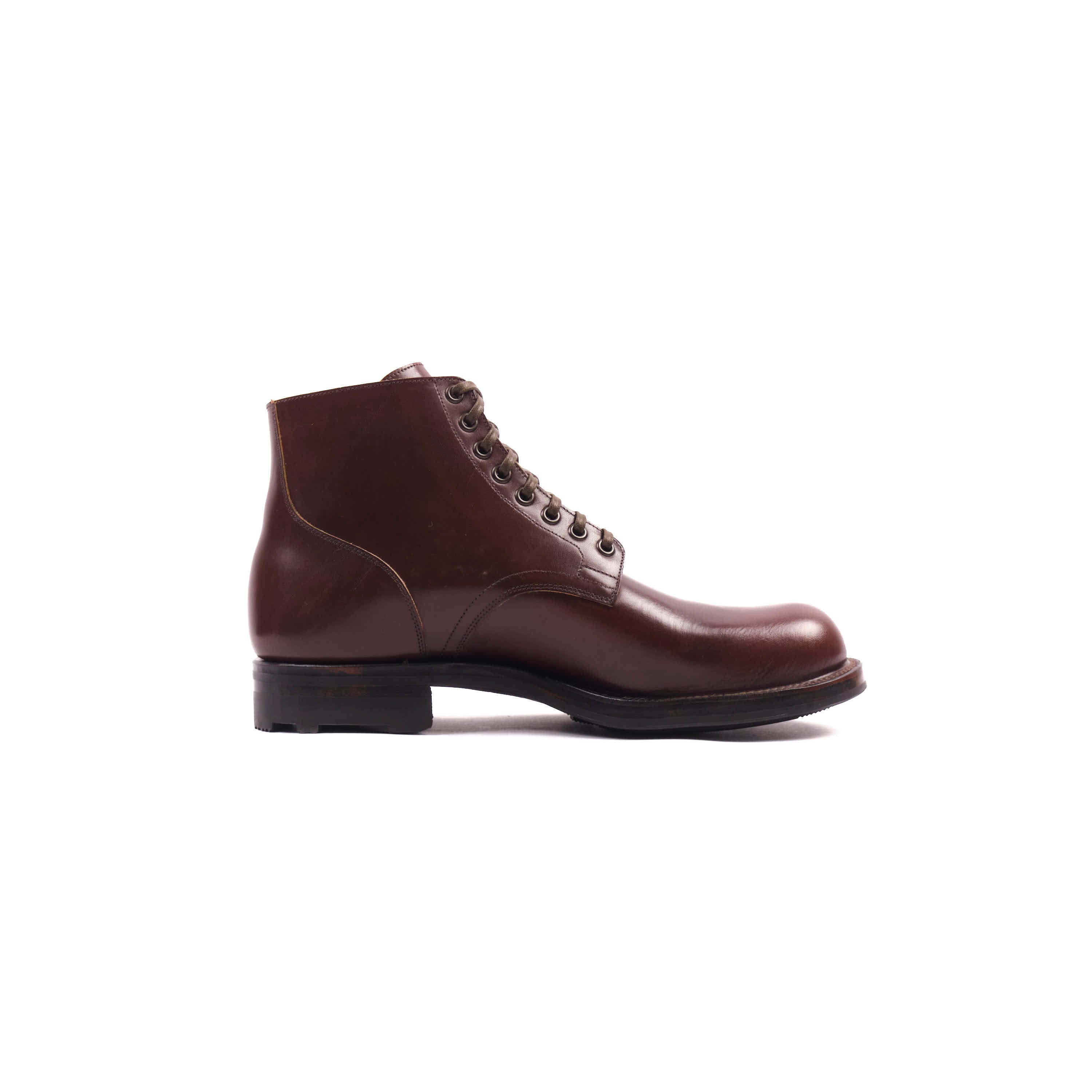 Brown leather boot on a white background